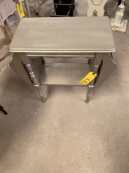 Painted magazine rack side table