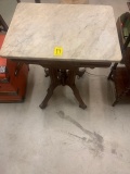 ANTIQUE MARBLE TOP TABLE ON ROLLERS