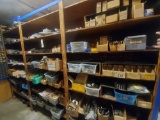 All new and used parts on shelf unit.