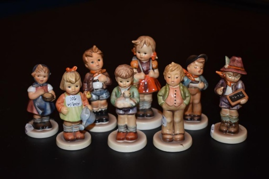 Eight small Hummel figurines six with boxes