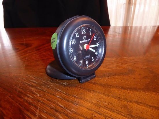 Maker: China - Model: Lifelong Travel Alarm - Movement: Quartz timepiece w/alarm - Dial: Black