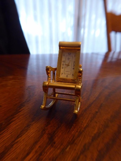 Maker: Unknown - Model: Novelty Rocking Chair - Movement: Quartz - Case: Gold - Similar to those