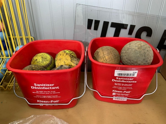 2 buckets of softballs