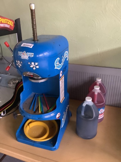 Ice cub shaving machine and snowcone flavoring