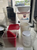 table lot of storage containers