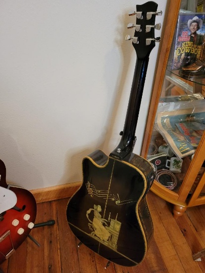 Unmarked 6 string guitar, has some cracks in the body, very well decorated, Mother of Pearl inlay
