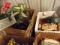 (4) boxes = Old rotary dial phones, silk flower arrangements, ext cords