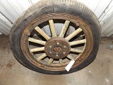 Old wood spoke wheel, rubber tire