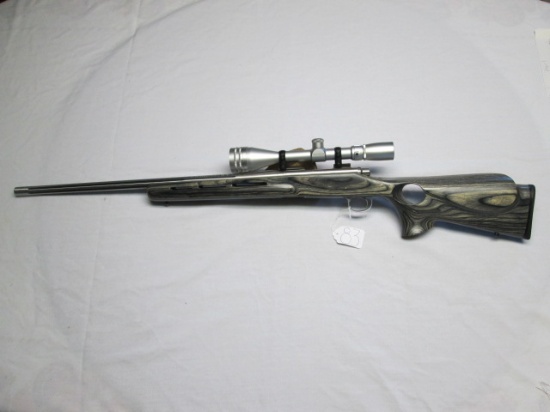 Remington .223 bolt repeating M700 stainless fluted barrel, lam thumb hole