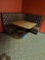 tufted back brown corner booth w/wood table