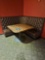 tufted back brown corner booth w/wood table