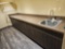 cabinets, counter, sink, wall shelving