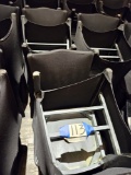 26)black wood chairs w/black covers