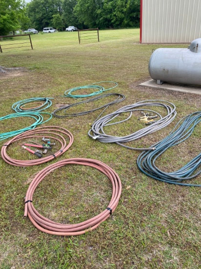 Bundle of water hoses, sprayers & misc