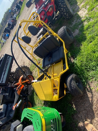 Yellow two seat go cart runs