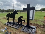 Praying cowboy with cross