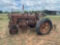 International Harvester Antique Tractor with Cultivator on the back