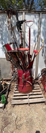 Barrel Full of Misc. Rakes, Shovels, etc.