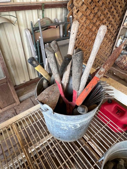 Water Pale Full of Garden Tools