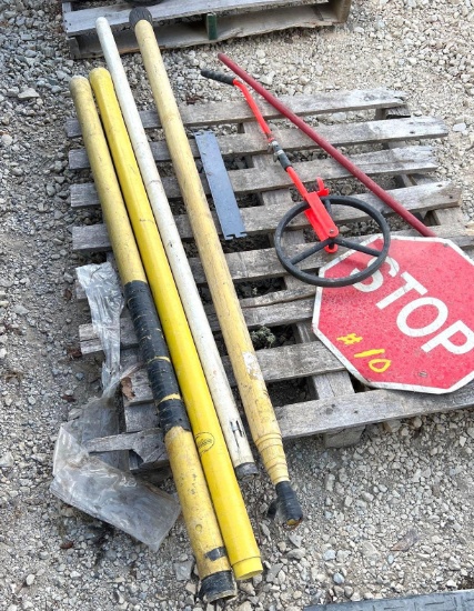 Pallet of Stop Signs, Measuring Wheels, and Fiberglass Hot Sticks