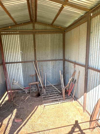 Contents inside the Shed: Tomato cages, post hole digger, shovels, etc.
