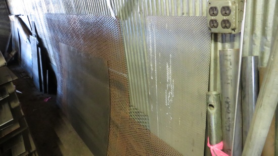 MISC METAL SHEETS LEANING ON WALL