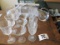 2 Glass Pitchers And Assorted Stemmed Glassware