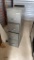 1 gray metal filing cabinet