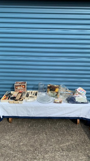 Misc kitchen utensils and glass pitchers and glass serving bowls