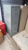 1 gray metal filing cabinet