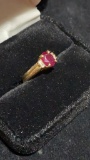 Woman’s gold ring w/ red ruby. Weights 4 grams