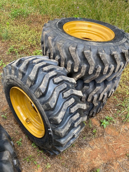 (UNUSED) set of 4 new 12-16.5 SKS332 tires on NH/JD/CAT/Gehl rims