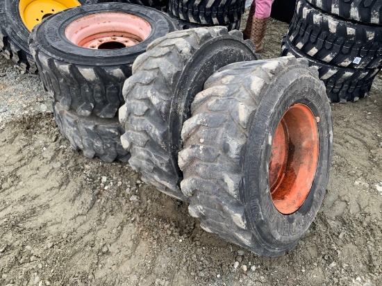 Set of 4 USED 12-16.5 SKID STEER TIRES AND RIMS