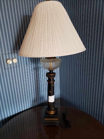 Table lamp, black column, with glass hurricane globe beneath shade