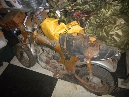 Gold Honda Mini-Trail Motorcycle  with Torn Seat