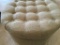 Tan Round Cloth Storage Ottoman