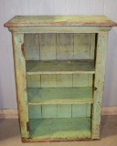 Green painted open cupboard