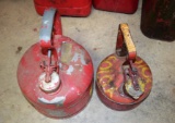 2 small metal gas cans
