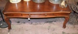 Cherry finish coffee table w/ drawer