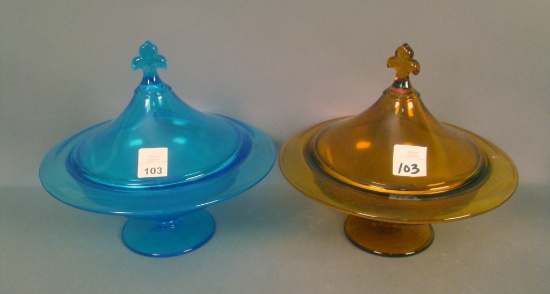 Pair of Co-Op Flint Ftd. Covered Compotes Blue and Amber with Fleur de lis Finials
