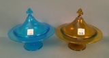 Pair of Co-Op Flint Ftd. Covered Compotes Blue and Amber with Fleur de lis Finials