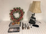 Wreath, serving spoon, tray, and lamp