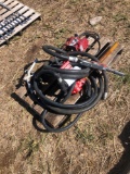 2 fuel pumps hose and nozzle