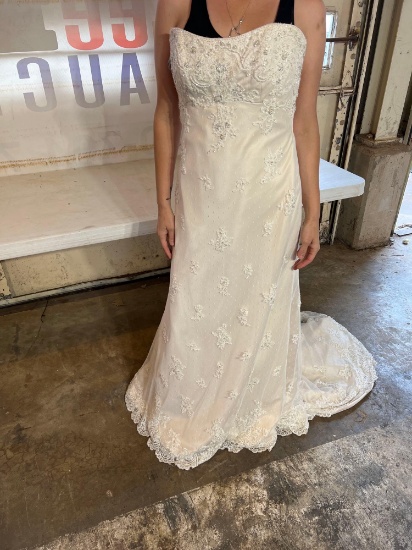 Size 12 wedding dress never been worn and no alterations were made...