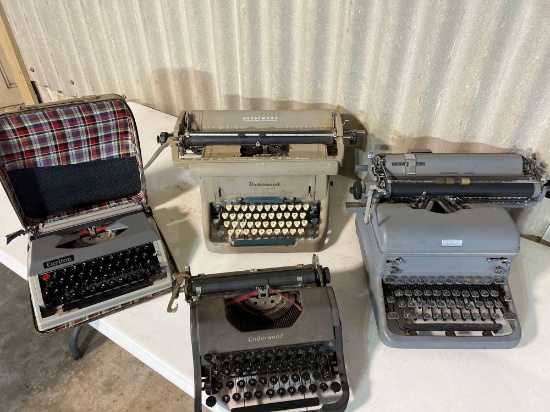 4 vintage type writers....