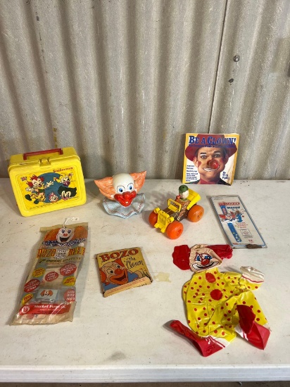Ceramic clown head, lunchbox, fisher price car....