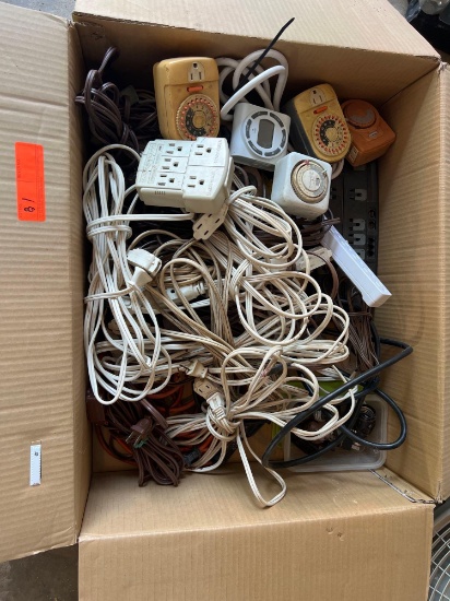 BOX OF EXTENSION CORDS AND TIMERS...