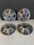 4 misc Mustang hubcaps....