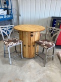 ROUND BAR WITH 2 CHAIRS TABLE IS 3FT ROUND AND 3 FT TALL TWO STOOLS WITH COWHIDE FABRIC