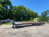30' FLATBED TRAILER WITH 5' DOVETAIL AND RAMPS HAS A GOOD FLOOR WITH THE CENTER OF IT WOOD AND SIDE